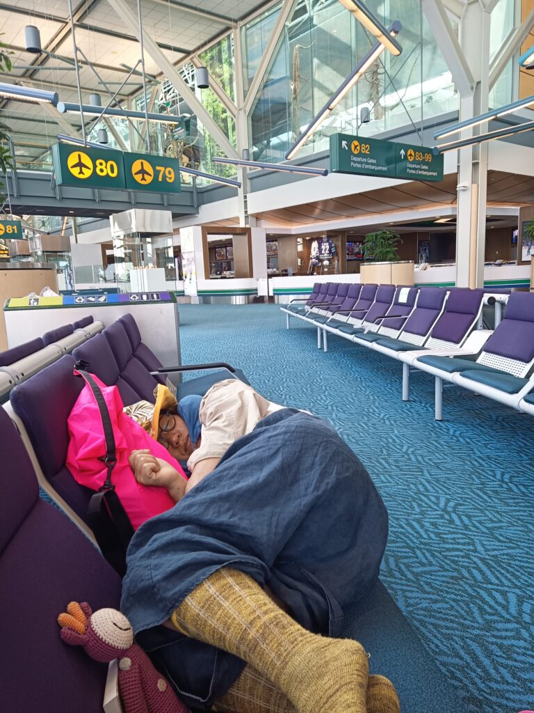 wifey sleeping at YVR airport
